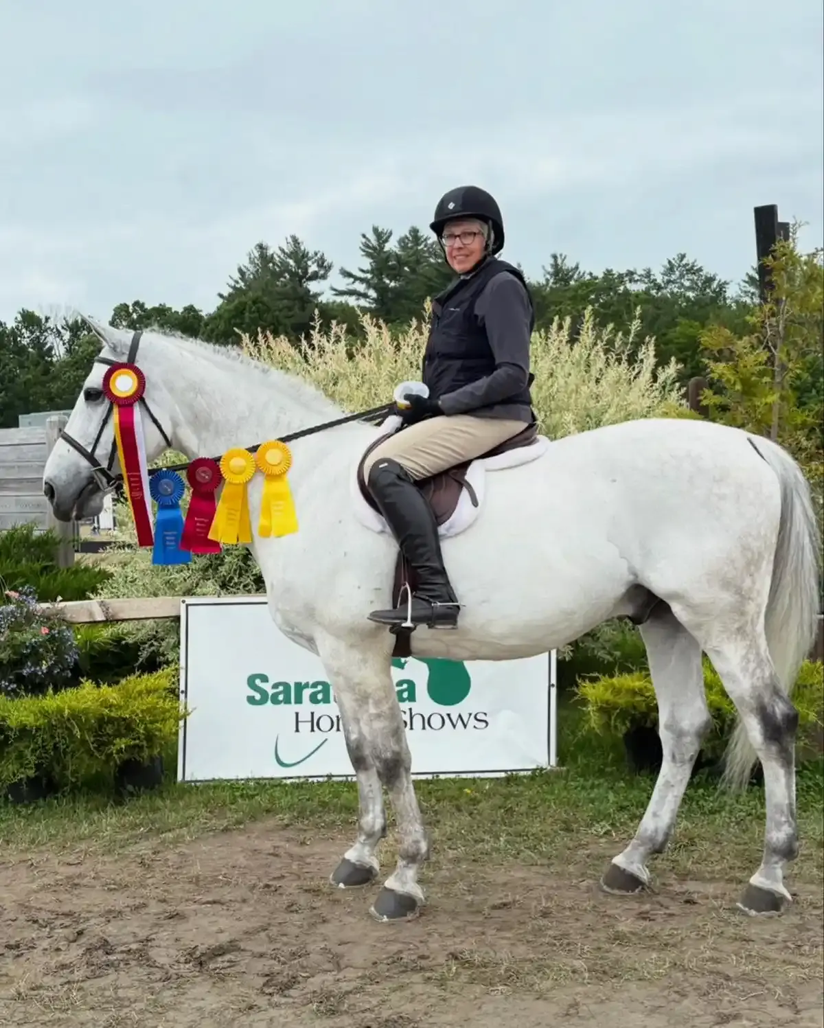 Rider on gray horse at Saratoga